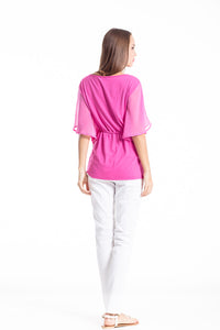 Top with flowing batwing sleeves and a tie waist by Conquista